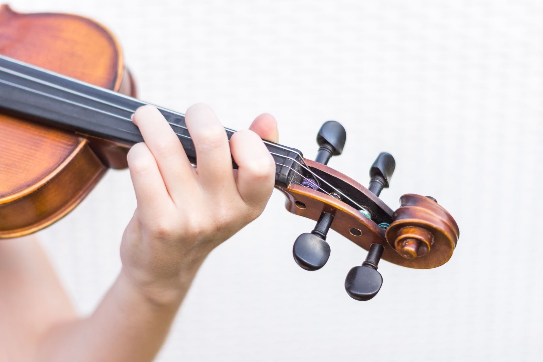 detail of fiddle mast with hand touching